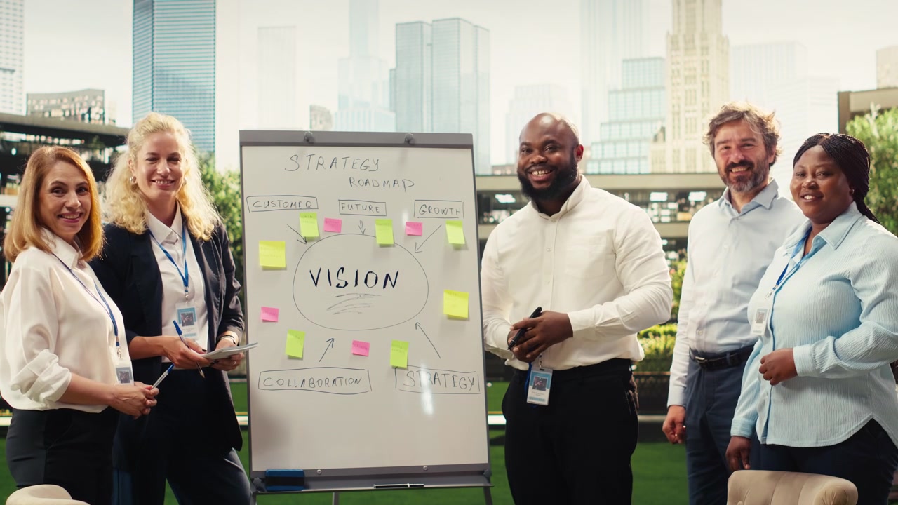 Portrait of diverse business team planning project timeline on whiteboard