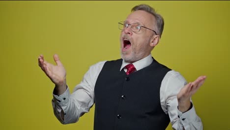 Portrait of happy businessman. Surprised businessman isolated on yellow background
