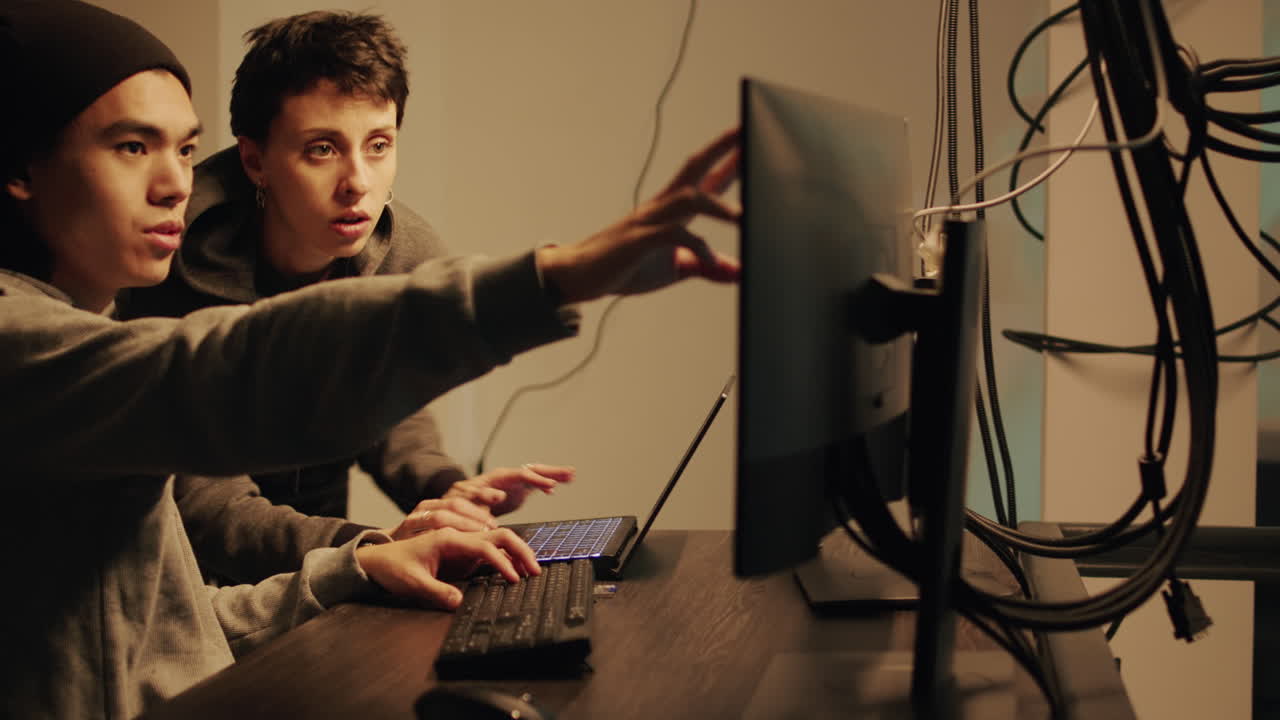 People working on a computer at a desk