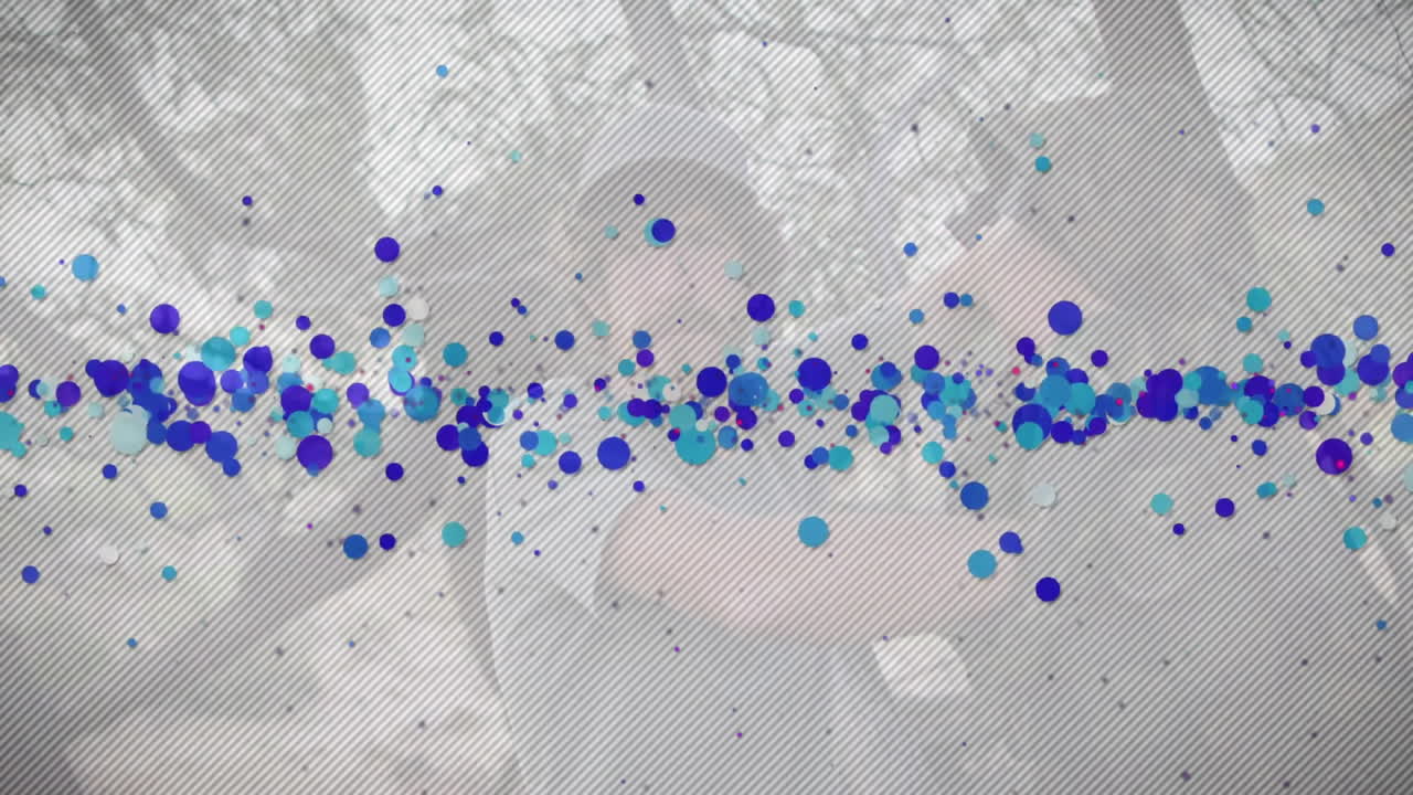 Man wearing baseball cap, with diagonal stripes and animated floating blue circles for marketing