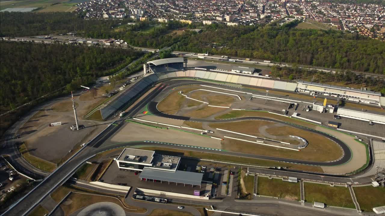 Aerial view of a race track and surrounding cityscape