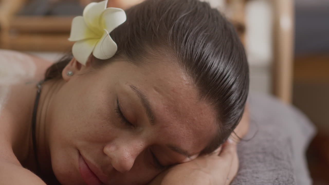 Woman Relaxing during Procedure of Back Skin Peeling at Salon