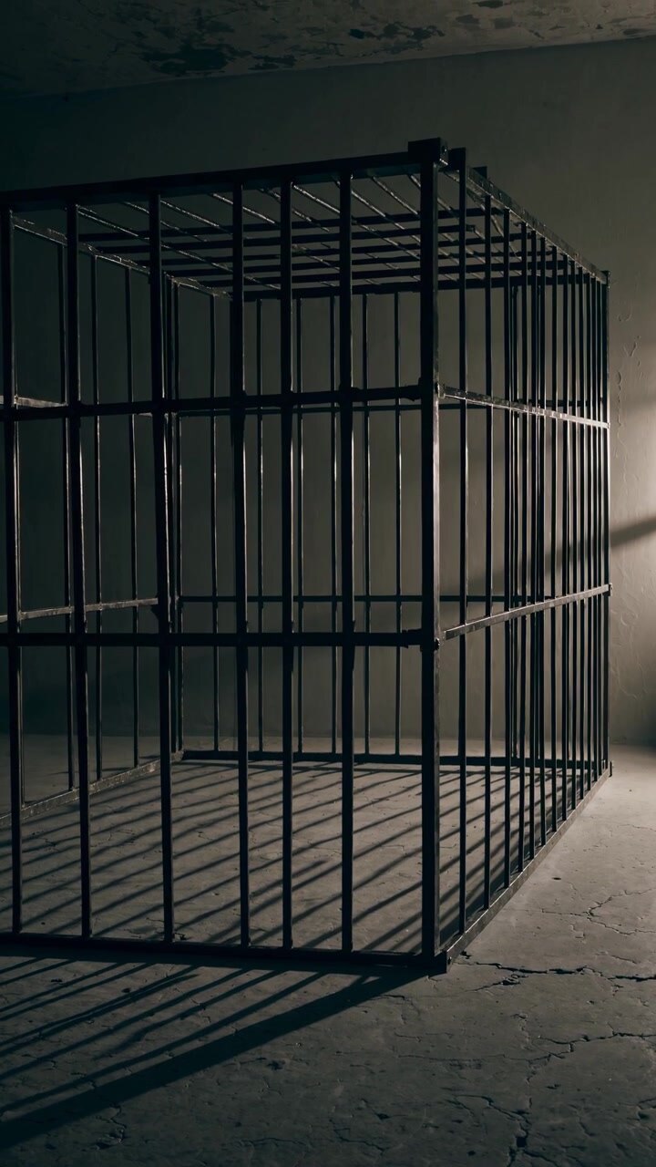 Empty Metal Cage in a Dark, Gritty Room