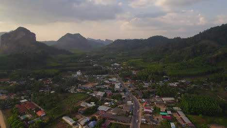 Secondary-road-between-limestone-rocks-at-sunset-in-Krabi,-Thailand