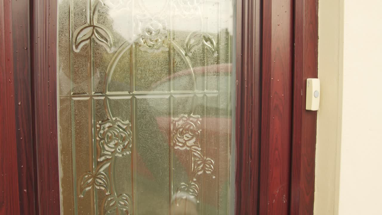 Man in Suit at Residential Front Door