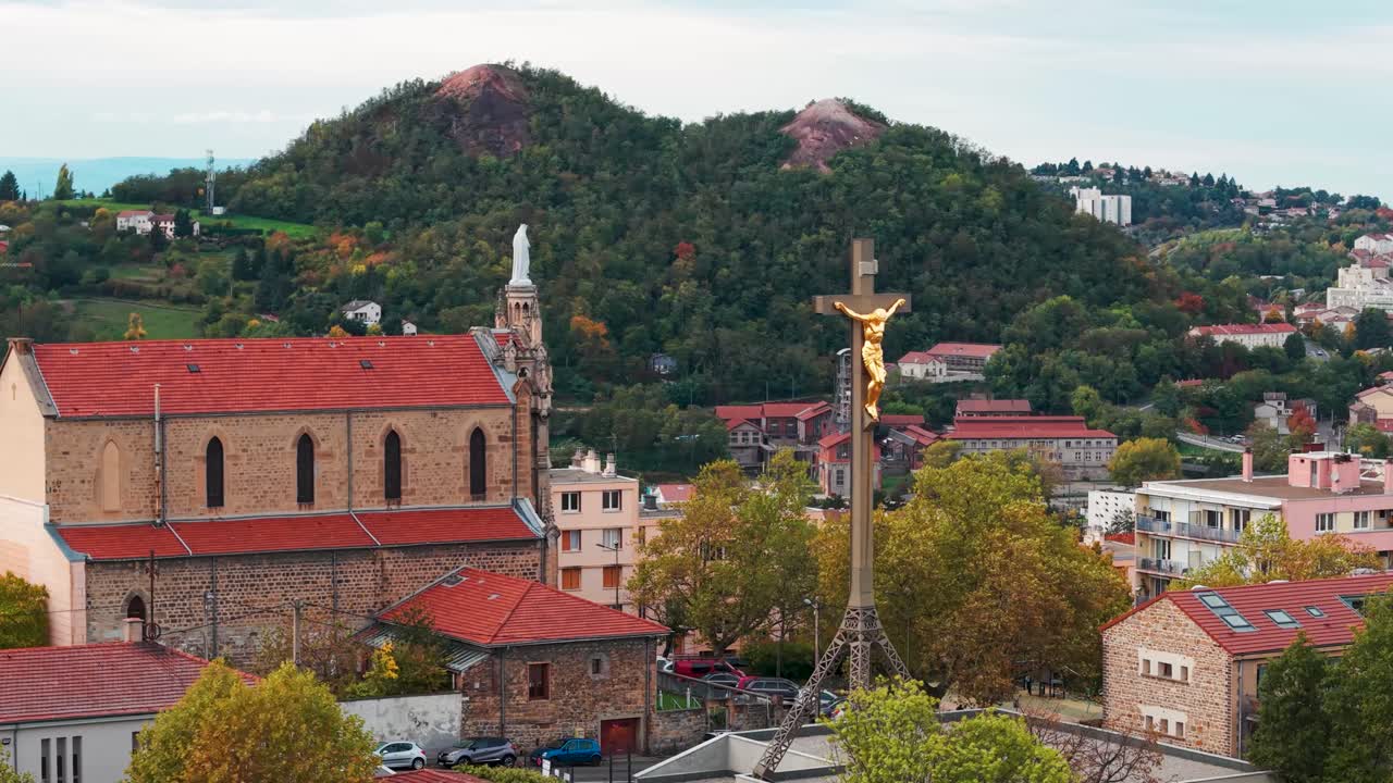 Aerial shot around the Colline des Peres in Saint Etienne city with Saint Mary's church and the Puit Couriot in the background, Loire departement, Auvergne Rhone Alpes region, France