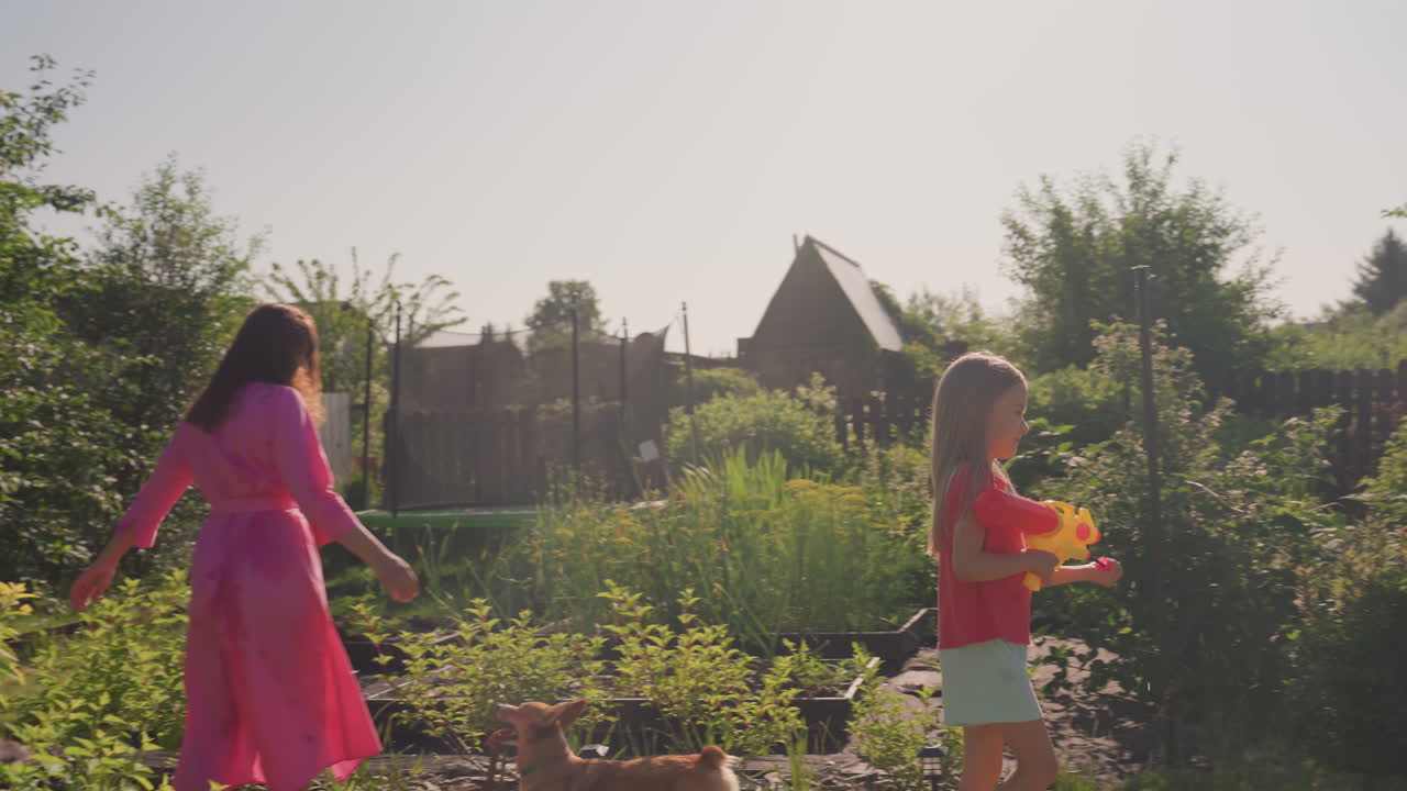 Girl Learns Planting By Mother, Mother And Daughter Engaged In Gardening Under Sunny Pergola, Mother Guides Her Young Girl Through Planting Flowers In Sunny Backyard With Wooden Structure