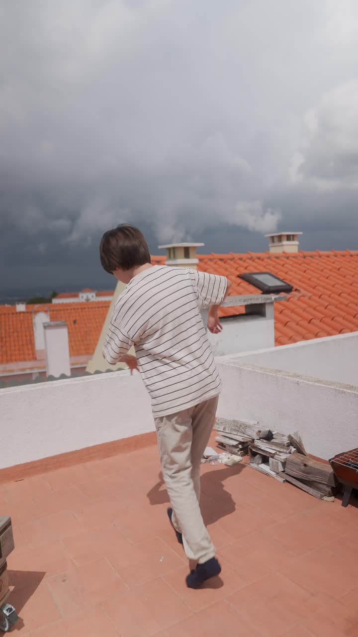Happy Boy Dancing on a Rooftop