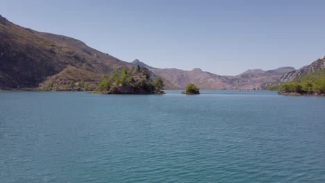 calm blue waters of oymapinar dam with taurus mountain landscape in manavgat, antalya, turkey