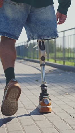person with prosthetic leg walking