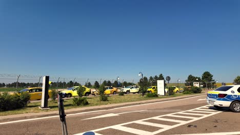 a line of taxi cabs parked at an airport