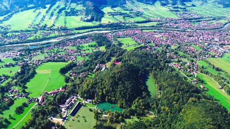 aerial flight over green valley and small villages, 4k