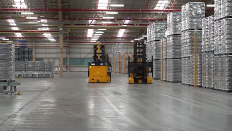 automated forklifts operating independently in a warehouse