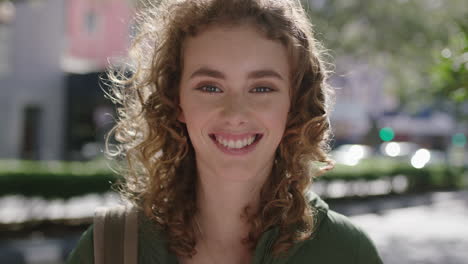 portrait of beautiful young elegant woman redhead on city street smiling cheerful optimistic enjoying happy urban lifestyle