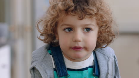 portrait happy little boy smiling at camera cute child looking cheerful expression