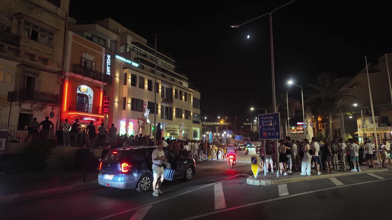 Paceville Nightlife Scene with Crowds and Traffic