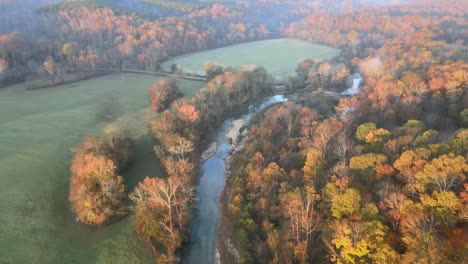 4k drone footage - following a creek during sunrise