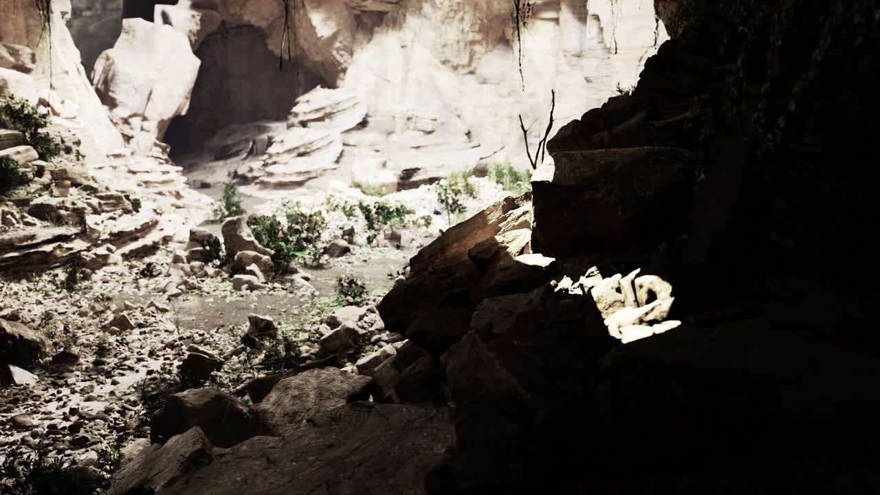 Light breaks through rocky canyon creating mysterious shadows and textures