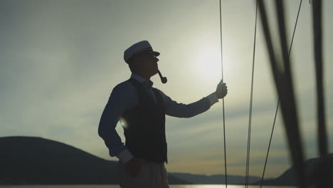 captain on deck at sunset