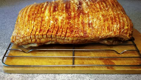 4k60 zooming in close-up view of danish roast pork with crackling - handheld dolly forward shot