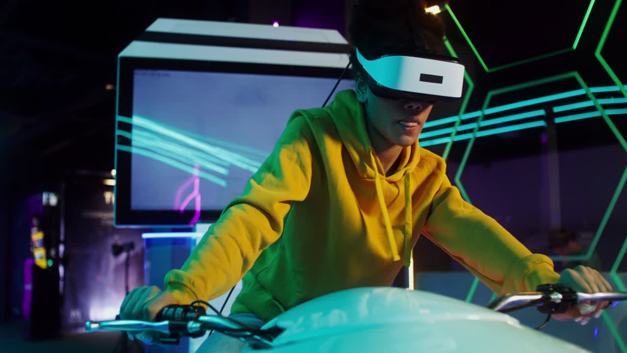 A young person experiences virtual reality in an entertainment arcade