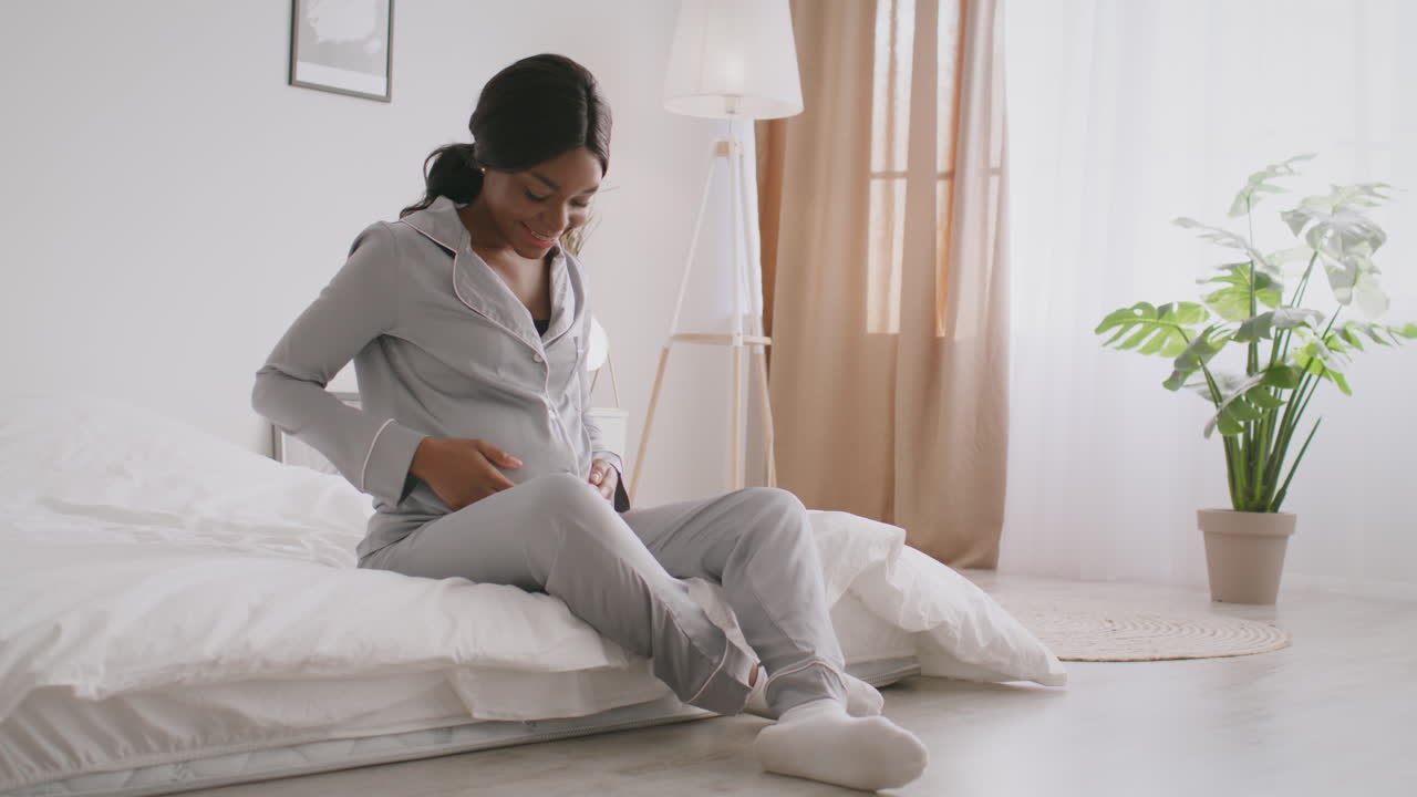 Pregnant Woman Relaxing in Bed