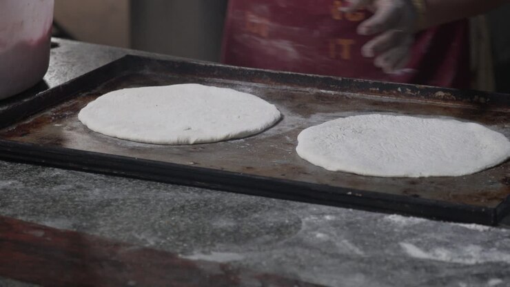 Arranging Chapatis and adding sweeteners and flavouring in the mix