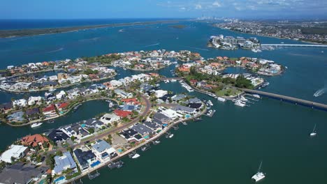 panoramic view over sovereign islands in paradise point, gold coast, queensland, australia - drone shot