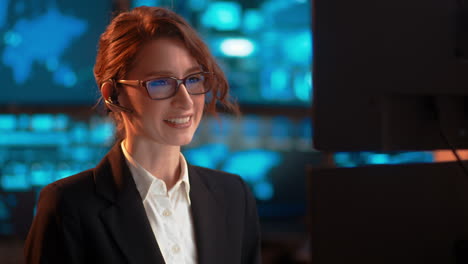 slow pan, a businesswoman at work talking through her bluetooth headset, in a customer service-type industry, having a pleasant friendly conversation