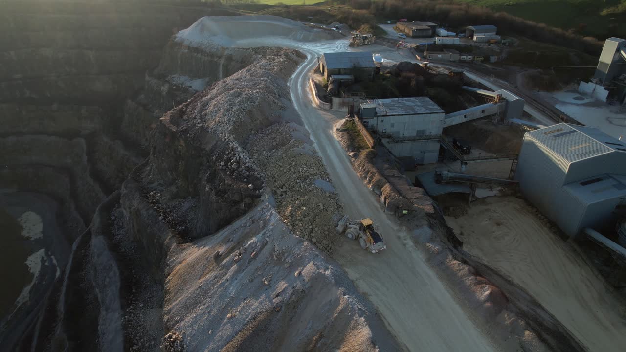 Digger moving gravel in a quarry