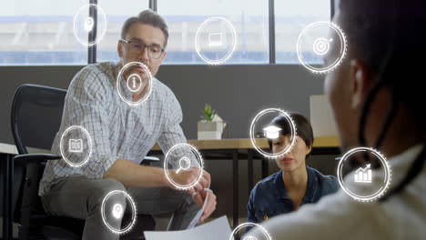 animation of digital icons with data processing over diverse business people in office