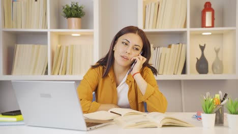 Female-student-Talking-Unhappy-On-The-Phone.