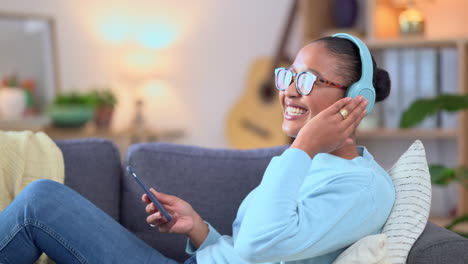 woman streaming music on phone while wearing