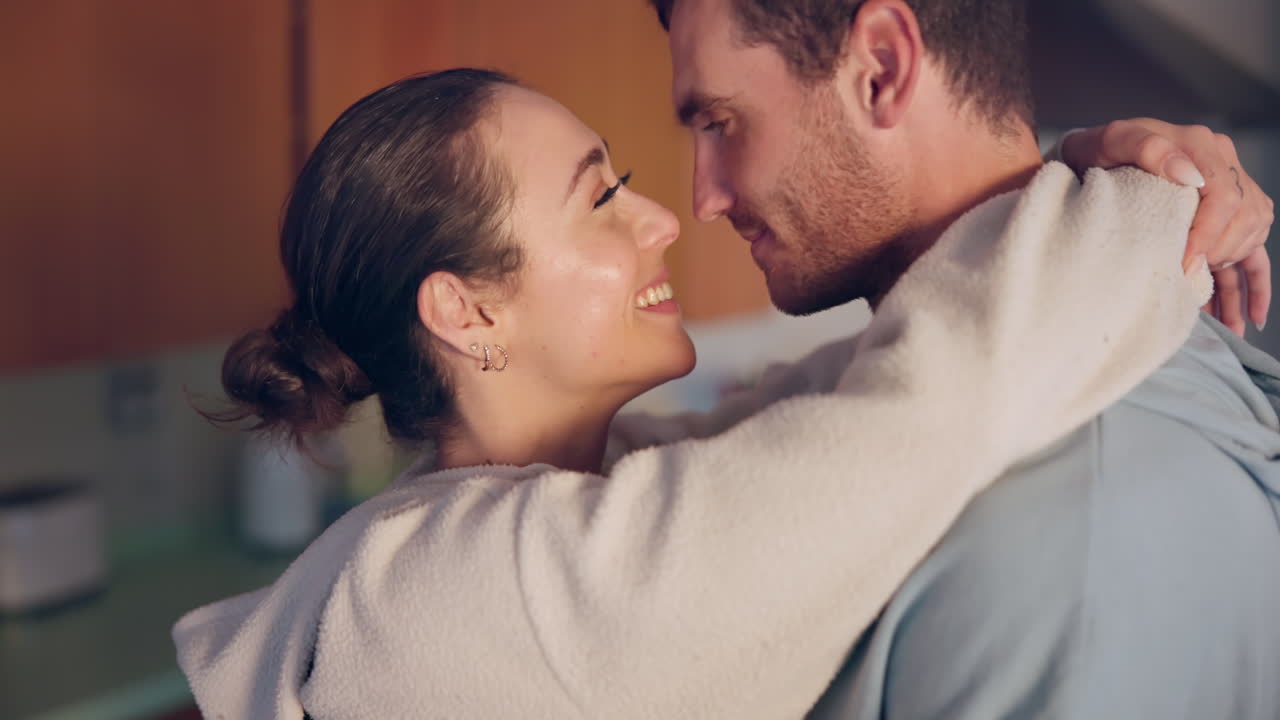 Couple, hug and forehead in kitchen