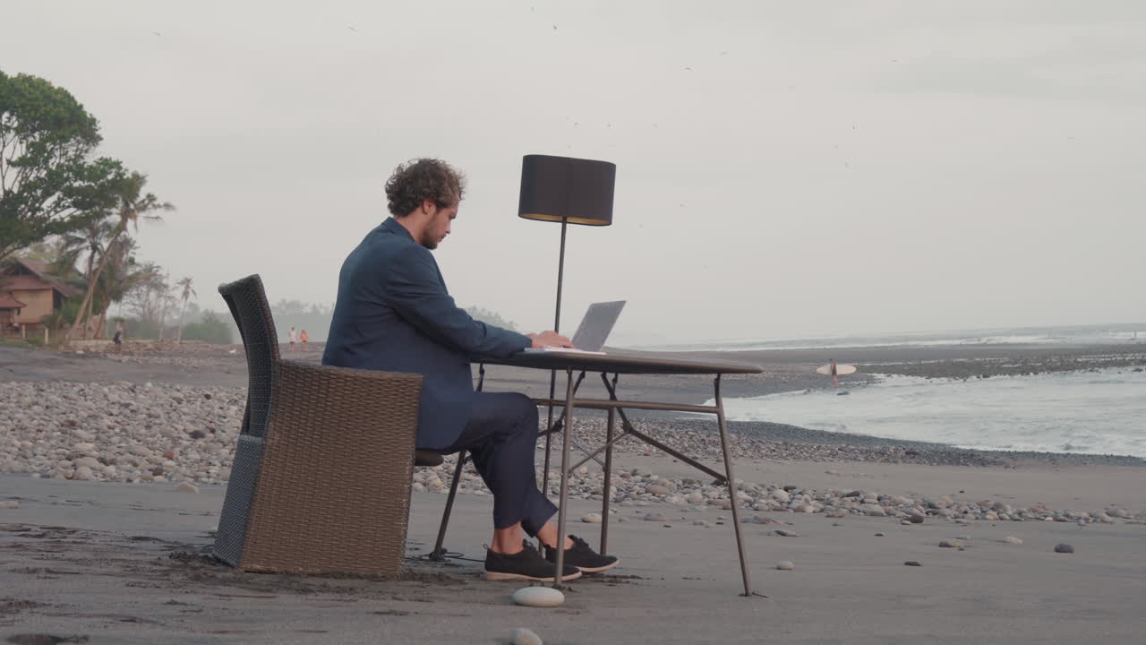 Man Working On Laptop In Tropics