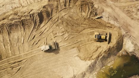 Aerial-photo-of-a-steam-roller-and-a-bulldozer-on-a-construction-site