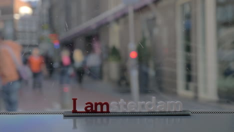 viewing city streets through tram window amsterdam