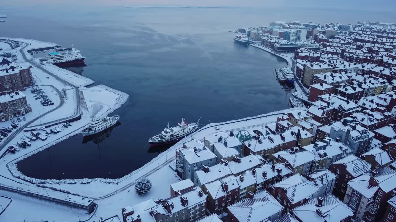 Aerial View of a Snow-Covered City Harbor in Winter