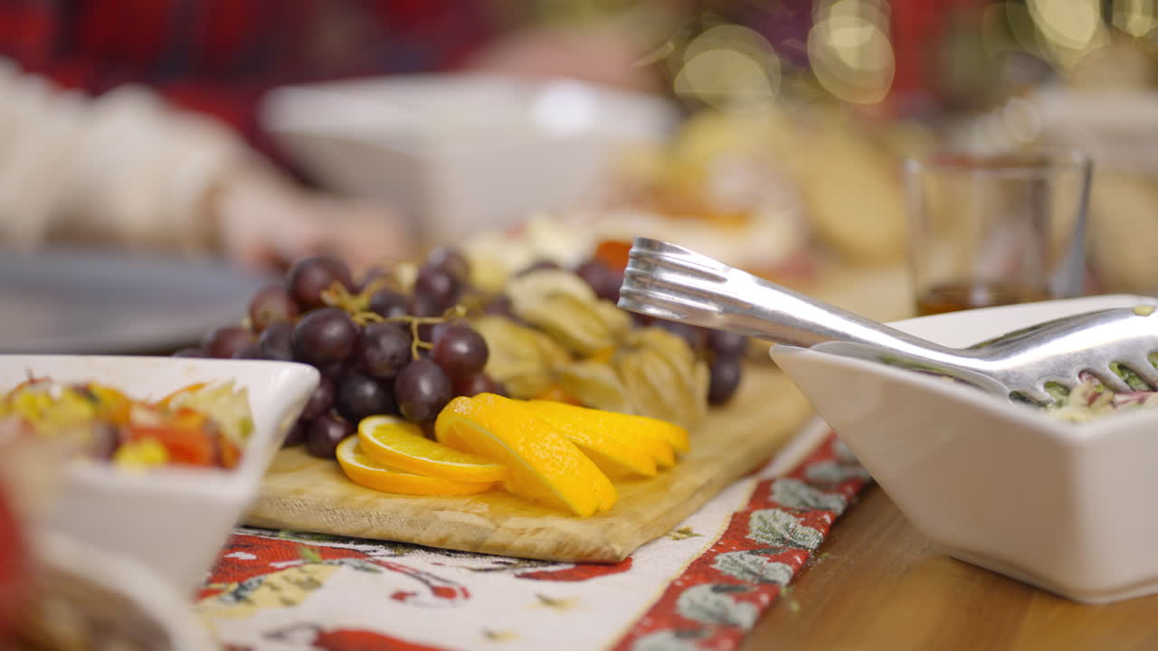 Festive table setting with grapes and orange slices