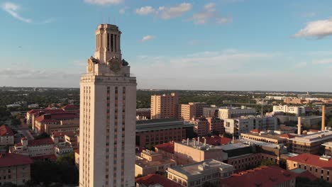 slow rise of the tower on ut campus revealing the sprawling buildings of the university