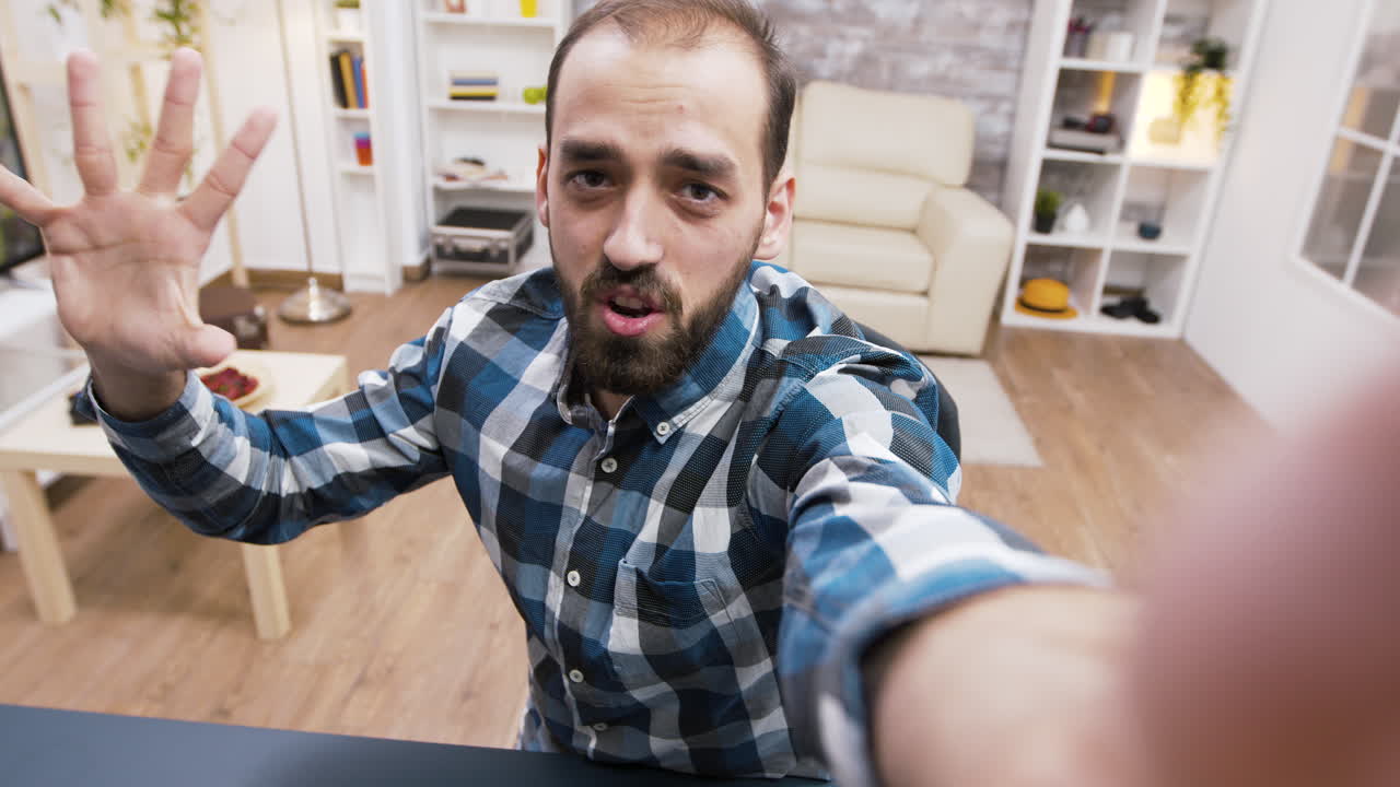 Man taking a selfie in his room