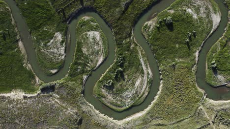 winding river in southern utah landscape, aerial drone top down view