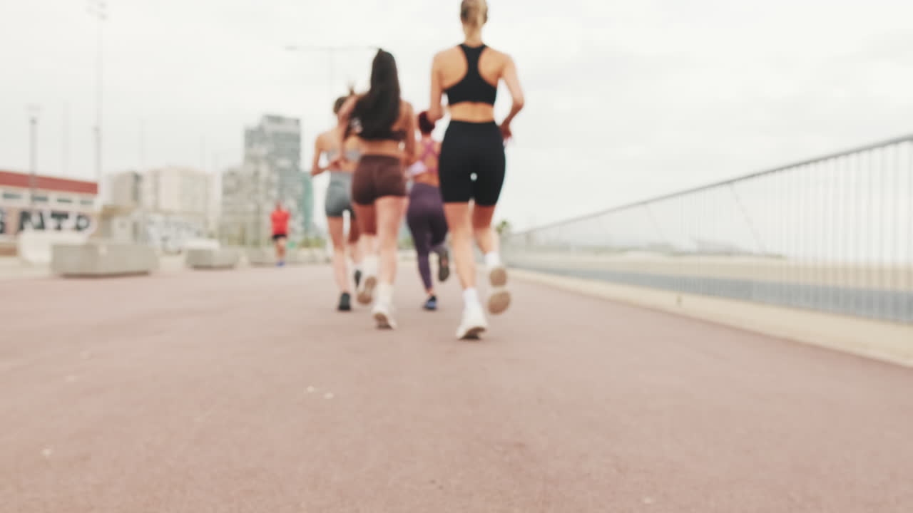 Four Girls Jogging in the City
