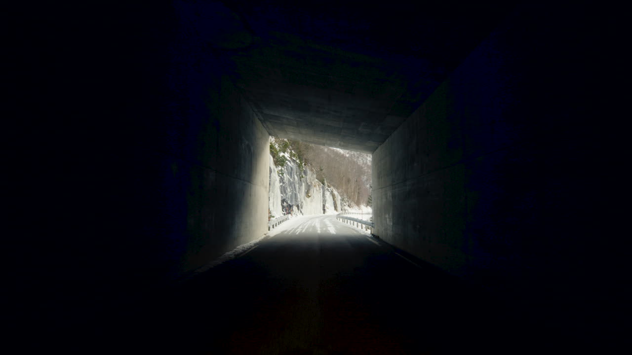 POV Of A Driver Driving On Tunnel Road Revealing Snowy Mountain Near Eresfjord In Norway.