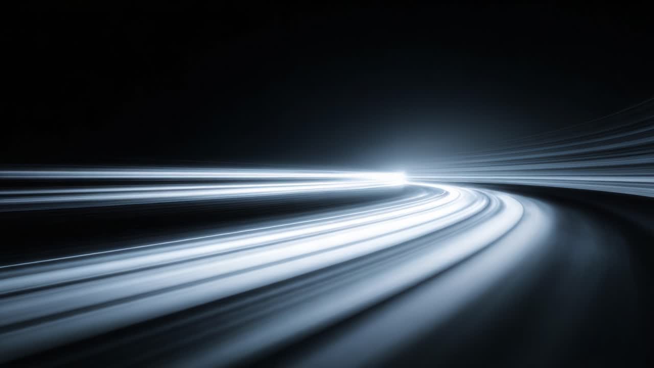 An Abstract Journey Through Light: Captivating Visuals of Motion with Smooth Curves and Radiant Trails in a Darkened Space