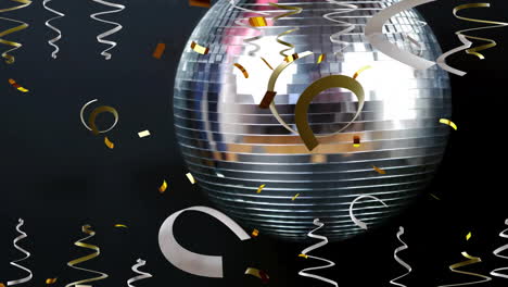 Animation-of-party-streamers-and-mirror-disco-ball-on-black-background