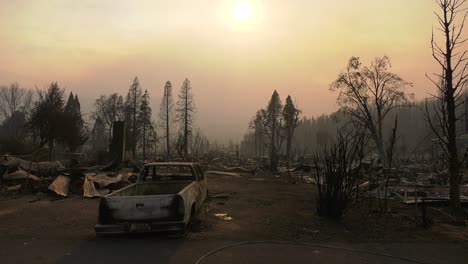 vehicles and town burned by wildfire