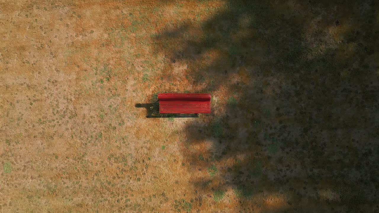 Top Down View Of A Park Bench And Field - Drone Shot