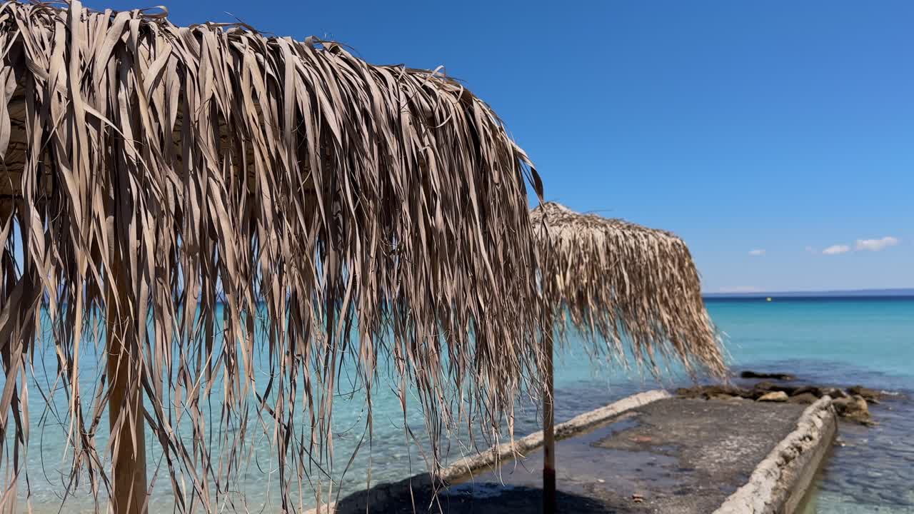 Stunning beach scene in Halkidiki, Greece, with elegant sunbeds facing the crystal-clear turquoise sea. A perfect summer escape in the heart of the Aegean.
