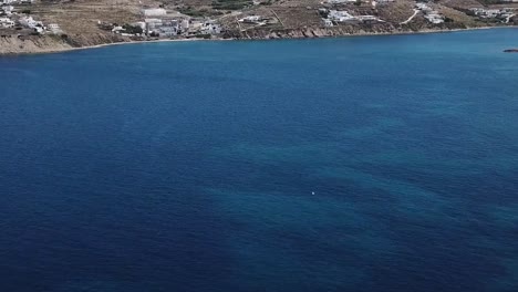 mykonos blue water shot with bird drone